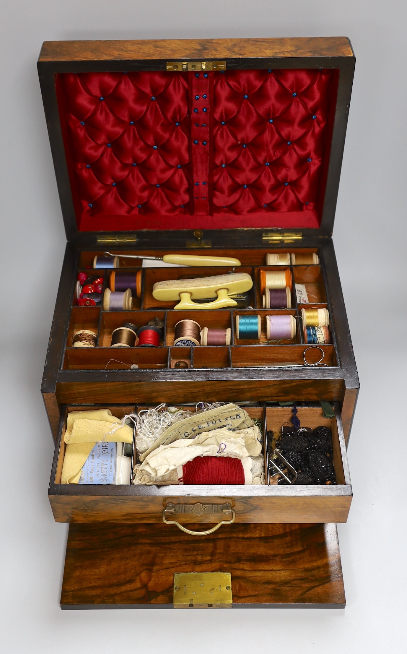 A Victorian walnut sewing casket with concealed spring loaded writing slope, 33.5cms wide x 23cms high